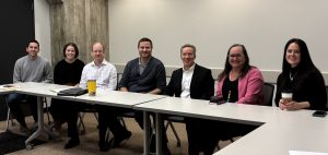 United Faculty Bargaining Committee sitting at conference table, 2025