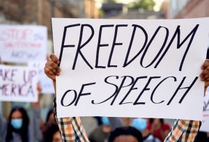 Freedom of speech protest, with sign held up